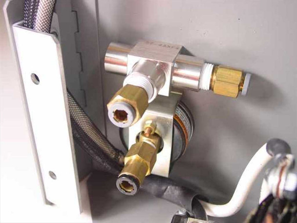 Accuvision 200 Power Supply – close-up of pneumatic manifold block with brass compression fittings and braided hose connections