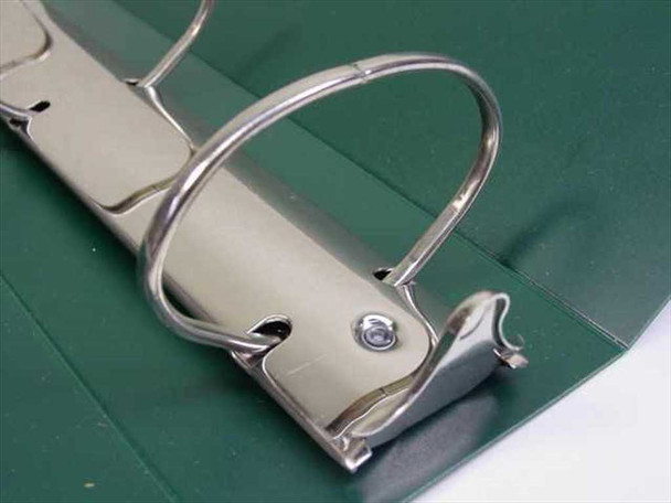 Close-up of GBC 3.5-inch metal ring mechanism on green binder showing locking hardware detail