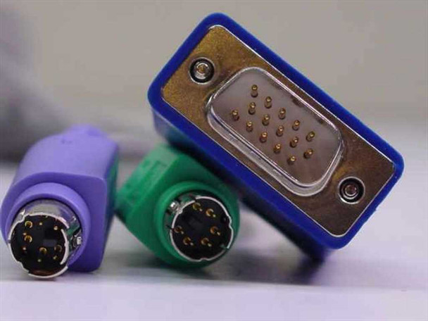 Close-up of KVM cable connector end showing VGA HD15 male (blue hood), green PS/2 mouse connector, and purple PS/2 keyboard connector