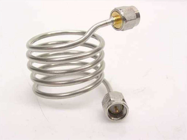 Stainless steel coiled coaxial cable SMA male to SMA female – side profile view showing coil form and both connectors extended