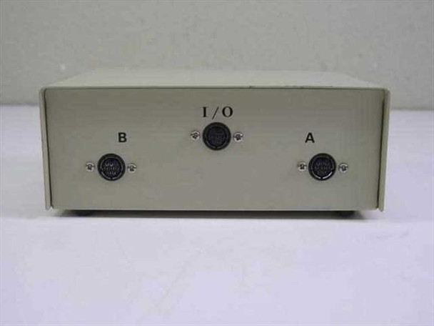 Front panel close-up of 2-way Apple printer data switch showing I/O, B, and A labeled 8-pin DIN connectors