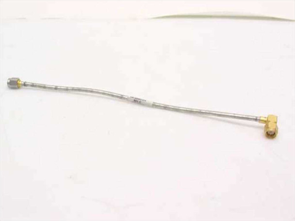 Semi-rigid coaxial RF jumper cable full view — SMA male straight connector on left, SMA male right angle connector on right, approximately 7–9 inches long