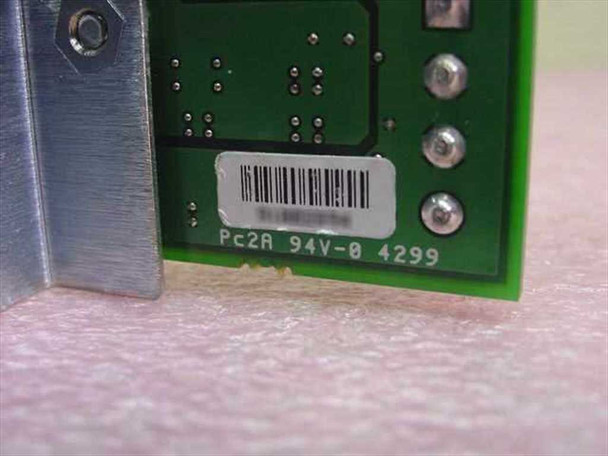 Close-up of Fiber Channel PCB label showing Pc2A 94V-0 4299 markings and barcode sticker on green circuit board