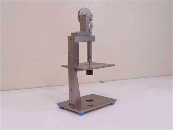 Custom tolerance measurement fixture side view showing full height, vertical column, work table, and base with rubber feet