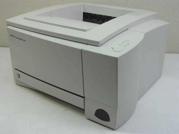 HP LaserJet 2100xi laser printer left-side and top view showing paper output tray and control panel button