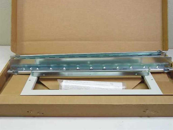 HP J1469A rack mount kit showing metal slide rails and white bezel panel in open box