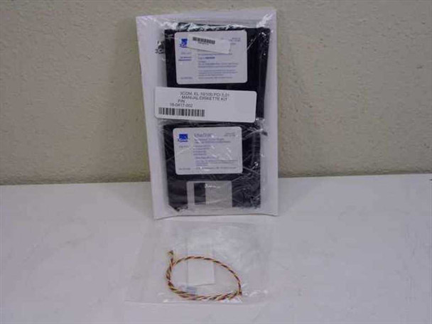 Open-box contents showing IBM 09N3601 adapter accessories: driver floppy disk, installation guide packets, and cable tie on pink anti-static foam