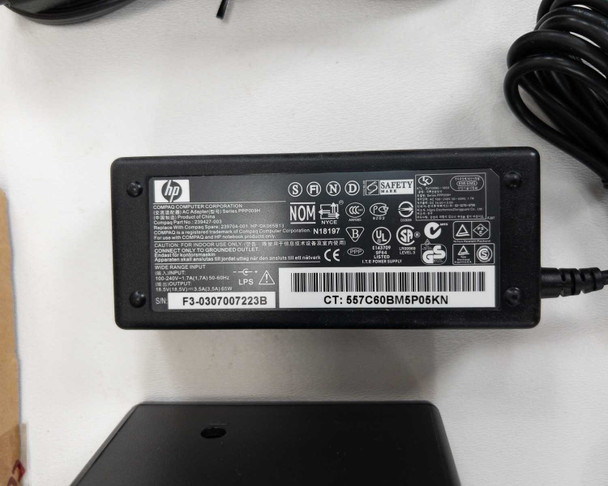 HP PPP009H AC adapter bottom label — shows input 100-240V 1.7A 50/60Hz, output 18.5V 2.7A, UL and safety certifications, model PPP009H