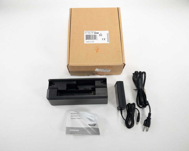 Compaq 135555-001 Universal Battery Charger full kit — charger dock, PPP009H AC adapter, power cord, warranty booklet, and original box laid out on white background