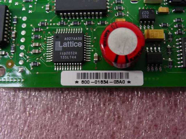 Close-up of Cisco WIC-1B-U PCB showing Lattice isp2032A 135LT44 FPGA chip and board barcode label 800-01834-03A0