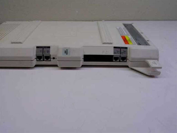 AT&T Partner 103D Module – front port side showing dual RJ modular port connectors and warning label