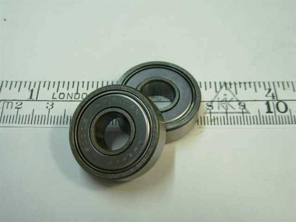 6000-2Z double shielded steel ball bearing 10x26x8mm shown alongside a ruler for scale — front and angled view of two bearings
