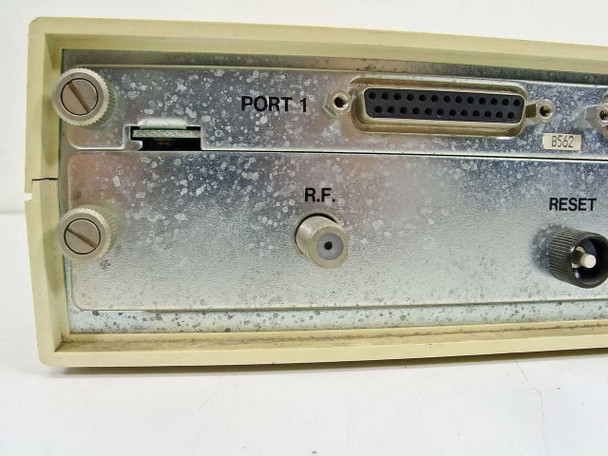 Sytek 2502 modem – side/rear angle showing Port 1 DB25 connector, RF coaxial connector, and Reset button