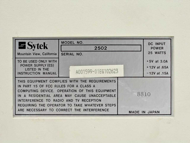 Sytek 2502 modem – bottom label showing model 2502, serial number, DC input power specs (+5V/3.0A, +12V/0.65A, -12V/0.15A, 25W), FCC compliance, and Made in Japan notation