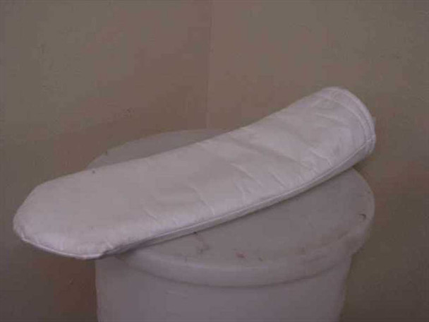 Cryo tote dewar carrier bag laid flat on top of white dewar, top-down angled view showing overall shape and length