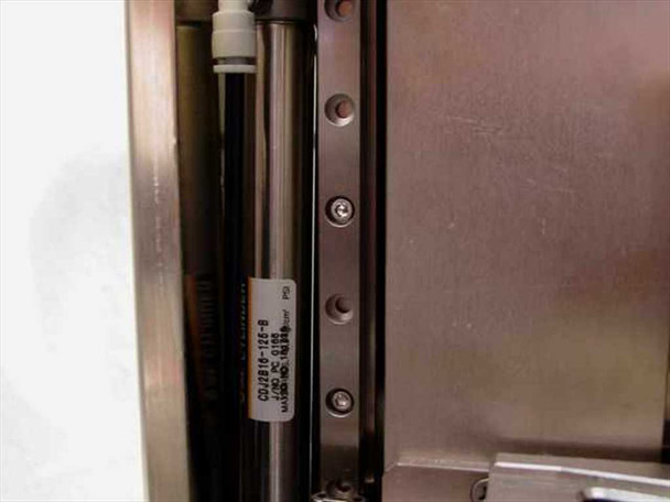 SMC CDJ2B16-12E-B pneumatic cylinder label on stainless steel punch column – side detail view