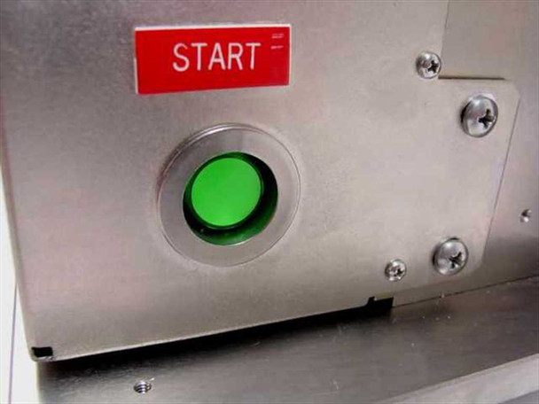 Start button close-up – green illuminated START pushbutton on stainless steel panel