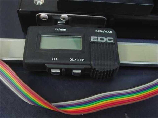 EDC digital linear slide measuring device – handheld display unit showing in/mm selector, DATA/HOLD button, OFF and ON/ZERO buttons, with ribbon cable attached