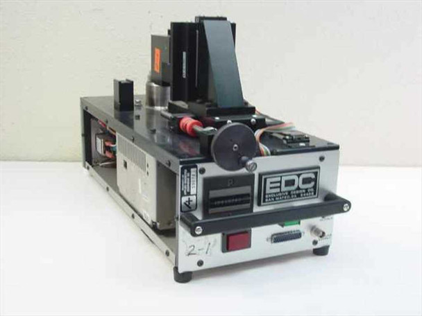 EDC Exclusive Design Co 551A-DTS-05 Disk Test Fixture – right front three-quarter view showing spindle assembly, linear slide, and EDC front panel with DB-25 connector