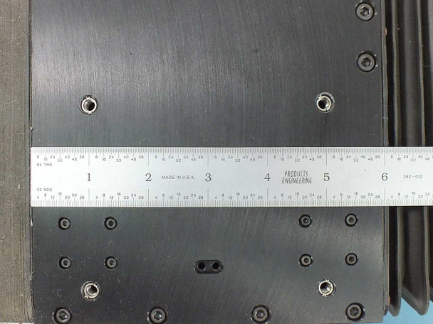 Lintech 47411 carriage top surface close-up with ruler showing approximately 6" stage length and threaded mounting hole pattern
