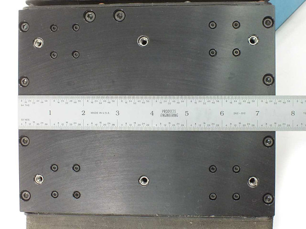 Lintech 47411 dual stage carriage top surface close-up with ruler confirming approximately 7.5" stage width and bolt hole grid pattern