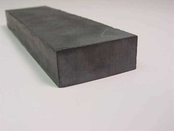 Pure Tech Inc Fe/Ta Cr alloy sputtering target — angled end view showing block dimensions and surface texture