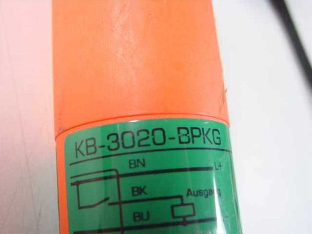 Efector KB-3020-BPKG proximity sensor — close-up of green label showing model number and wiring diagram with BN, BK, BU terminals