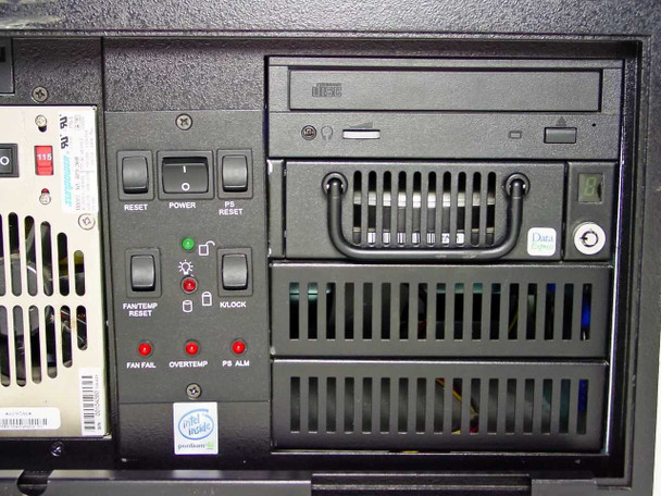 Clarent GC-A032-3 rear control panel close-up showing Reset, Power, PS Reset, Fan/Temp Reset, K-Lock switches and Fan Fail, Overtemp, PS Alarm LEDs with CD-ROM drive above