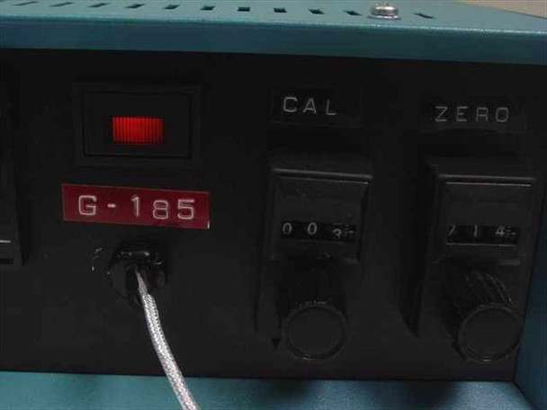 Analogic G-185 front panel detail showing G-185 model badge, power switch with red illuminated indicator, CAL and ZERO thumbwheel adjustment dials