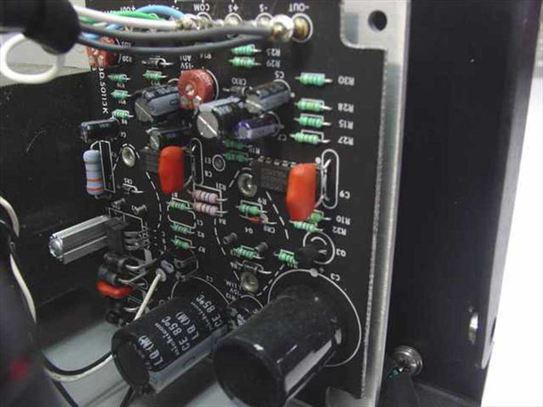 Interior circuit board view showing control/regulation PCB with capacitors, resistors, and trimmer components