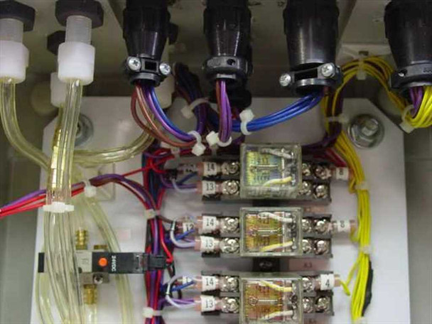 Himel control box interior close-up — upper section showing conduit entries, relay modules, and terminal blocks with wiring