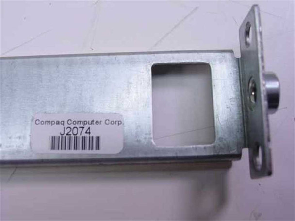 Compaq J2074 server rack rail end bracket — label showing Compaq Computer Corp and part number J2074
