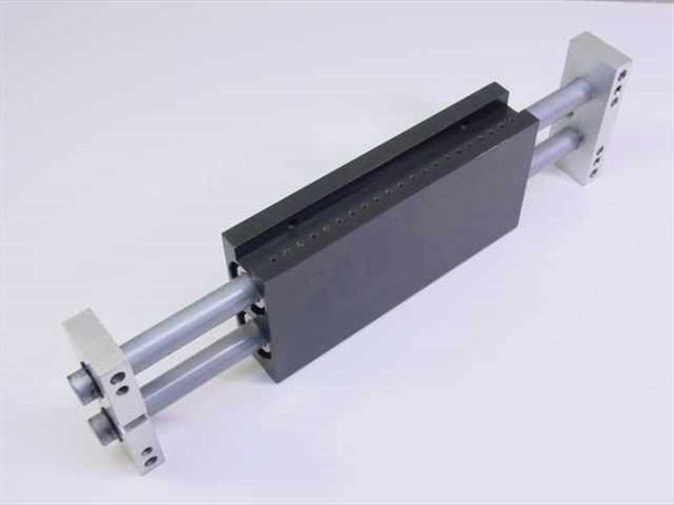 PHD MS062X6-E-V pneumatic linear slide — angled side view with carriage extended showing row of tapped mounting holes along the body