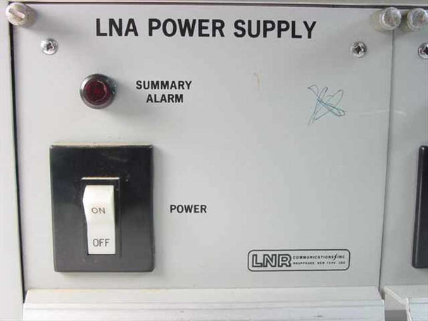 Close-up of single LNR Communications CF12 LNA Power Supply front panel showing Summary Alarm LED indicator, ON/OFF toggle switch, and LNR logo
