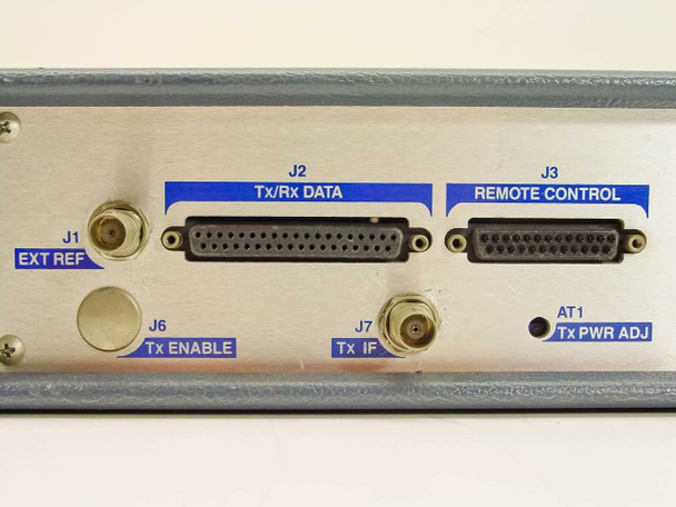 ComStream CM101 rear panel close-up — J1 Ext Ref BNC, J2 Tx/Rx Data D-sub 37-pin, J3 Remote Control D-sub 25-pin, J6 Tx Enable BNC, J7 Tx IF BNC, AT1 Tx Pwr Adj trimmer