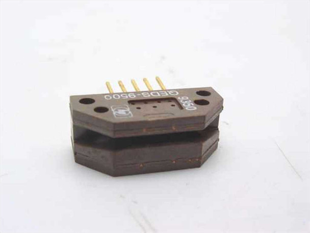 HP QEDS-9500 rotary position encoder — opposite side view showing optical aperture slot and model marking on housing