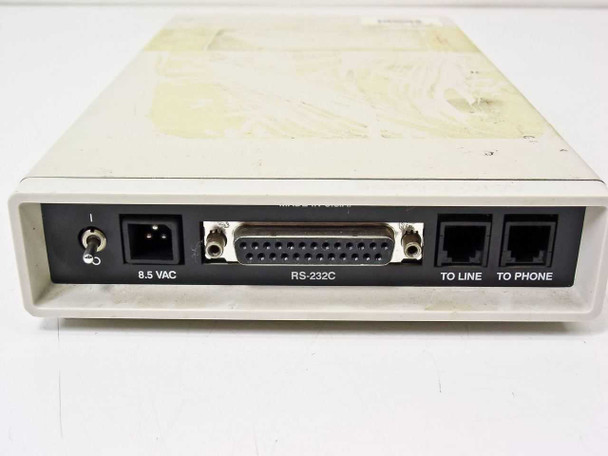 Unisys MDM24US external modem – rear panel close-up showing 8.5 VAC inlet, RS-232C DB25 connector, TO LINE and TO PHONE RJ11 ports