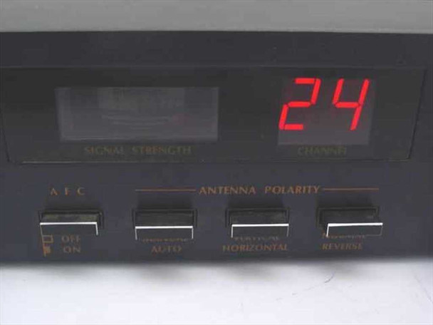 Transat 2M7 Satellite Receiver — front panel center display showing Signal Strength meter, Channel readout displaying 24, AEC switch, and Antenna Polarity selector buttons (Off/On, Auto, Horizontal, Reverse)
