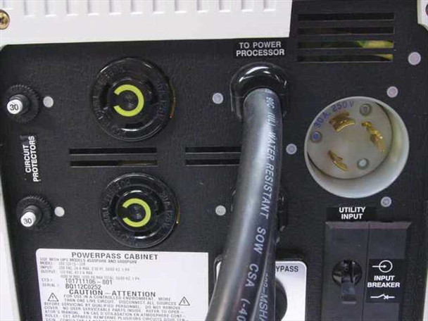 Exide PowerPass Cabinet rear panel close-up showing circuit protectors, utility input connector, and rating label
