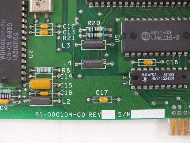 Close-up of WD1003-WAH PCB showing PCB part number 61-000104-00 REV label, UM6116-3 SRAM, and TI SN74LS245N logic IC