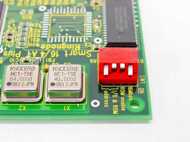 Madge Ringnode ISA card detail — Kyocera HC1-TSE 64.0000 MHz and 40.0000 MHz oscillators, red DIP switch (SW1) for I/O address, 16Mbps, ROM enable settings