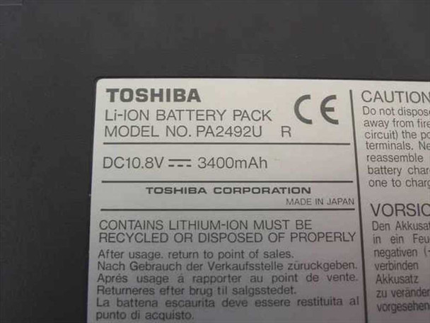Toshiba PA2492U Li-Ion Battery Pack label close-up — shows model PA2492U R, DC 10.8V 3400mAh, Made in Japan, CE mark, lithium-ion disposal notice