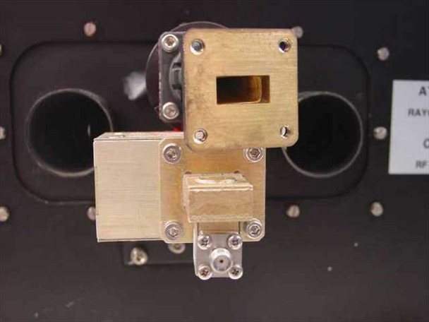 Thomson TH2485B klystron tube – close-up of waveguide output flange assembly showing rectangular Ku-band waveguide port and SMA coaxial connector on brass block