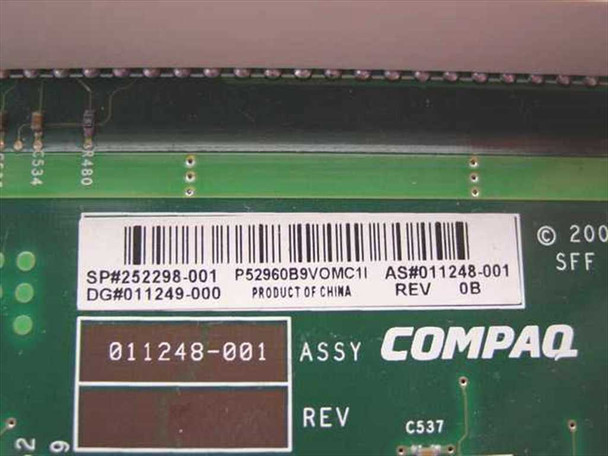 Compaq 252298-001 riser board label close-up showing SP# 252298-001, AS# 011248-001, Rev 0B, and Product of China markings