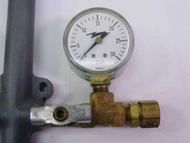 Detail view of individual 0-30 PSI gauge and brass valve assembly showing gauge face markings and compression outlet fitting