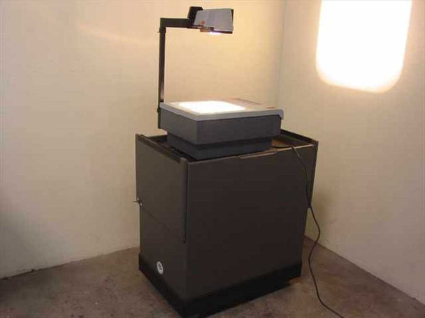 3M 905D Overhead Projector mounted on Egan Visual S2PM mobile presentation cabinet – full left-side view with projector arm raised and power on