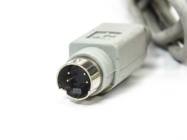 Apple Desktop Bus Mouse II M2706 – close-up of 4-pin Mini-DIN ADB connector showing gold pins