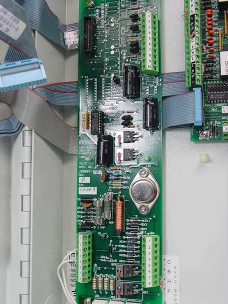 Monitor Dynamics MDI RTU-200 interior – telco board Assy No. 200007 Rev detail with terminal blocks, capacitors, transistors, and ribbon cable connections