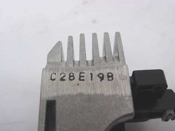 Epson C28E19B dot matrix printhead — close-up of print pins and stamped part number C28E19B on metal guide comb