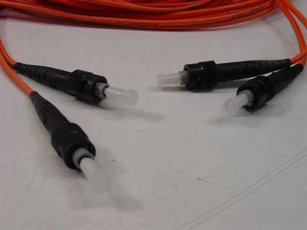 Close-up of both ST duplex connector pairs on the Siecor OFNR fiber optic cable showing ferrules and boots